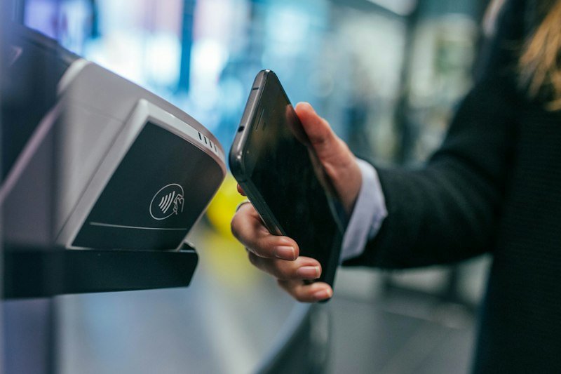 A smartphone being used with a payment terminal